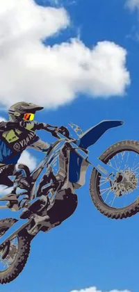 This phone live wallpaper features a thrilling scene of a dirt bike rider jumping in the air, captured in ultra-detail vector art