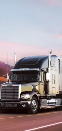 This beautiful live wallpaper features a silver semi truck driving through gorgeous mountain scenery