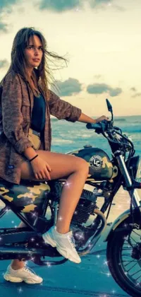 This phone live wallpaper displays a stunning scene of a woman on a motorcycle, situated against an idyllic beach backdrop