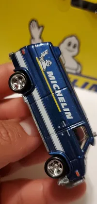 This live wallpaper showcases a high-quality, close-up shot of a detailed toy car in the form of a microbus