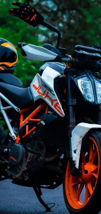 This phone live wallpaper features a stunning image of a motorcycle parked on a roadside