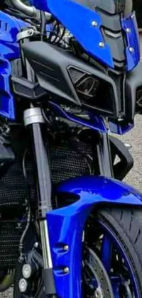 This live wallpaper showcases a blue motorcycle parked in front of a magnificent building