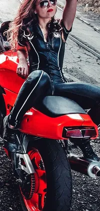 This stunning phone live wallpaper depicts a woman perched atop a sleek red motorcycle