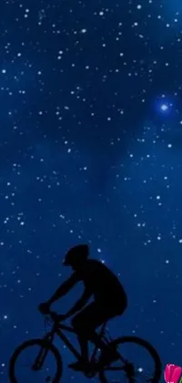 This phone live wallpaper depicts a bicycle rider gliding through the night sky against a beautiful backdrop of colorful galaxies