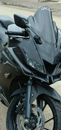 Looking for a cool and edgy live wallpaper for your phone? This wallpaper features a black pulsar motorcycle parked on the side of the road, captured in a full-body front shot