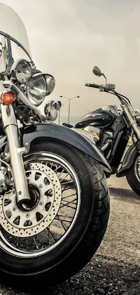 This live phone wallpaper features two parked motorcycles with a sleek and modern design
