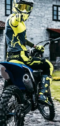 This phone live wallpaper showcases the action-packed scene of a man riding on the back of a dirt bike