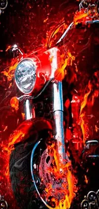 This phone live wallpaper features a close-up of a motorcycle against a blazing fire background