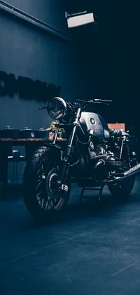 This live wallpaper showcases a striking motorcycle parked in a dimly lit room
