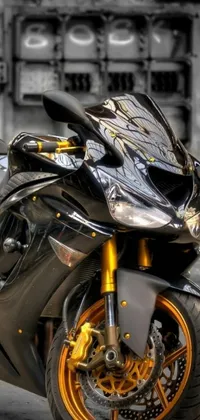 Experience the power and beauty of a black and golden armored motorcycle in this stunning live wallpaper