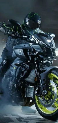 Looking for a striking live wallpaper? Check out this image of a man riding on a black motorcycle! With an impressive 8k resolution, this portrait shot perfectly captures the energy and power of the rider on the road