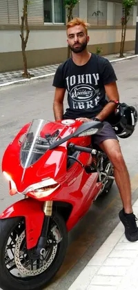 This motorcycle live wallpaper features a red Ducati Panigrale, with a rider in t-shirt and jeans on the back