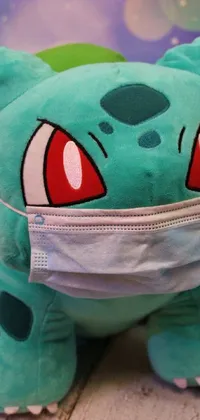 This <a href="/">live wallpaper</a> features a close-up of a stuffed animal wearing a medical mask, expressing concern and caution during the pandemic