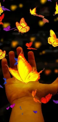 The butterfly-themed phone live wallpaper features a captivating close-up view of a person holding a glowing butterfly, surrounded by numerous yellow butterflies fluttering around