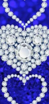 This phone live wallpaper showcases a glittering heart made of shining diamonds on a vivid blue background