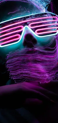 Looking for something electric for your phone wallpaper? This high-quality fantasy stock photo features a man with a beard and neon glasses, standing out against a dark background