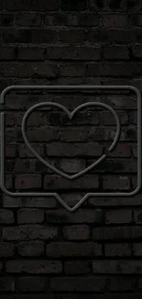 This live wallpaper features a textured brick wall with a delicate heart in the center