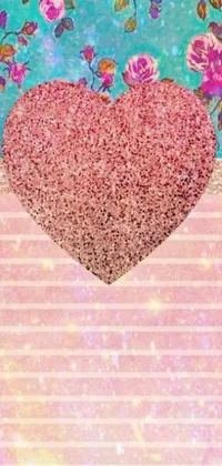 This phone live wallpaper features a pink heart made of scrapbook paper collage, placed on a glittery background with tiffany style elements