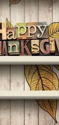This live wallpaper features a wooden sign with the words "happy thanksgiving" in a folk art style
