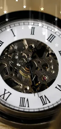 This phone live wallpaper showcases a stunning, high-detailed pocket watch resting on a wooden table