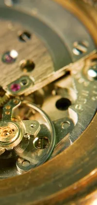 This phone live wallpaper showcases a captivating macro close-up of the inside workings of a vintage watch, captured in a photograph from 2020