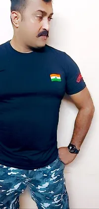 This live wallpaper features a man standing with hands on hips, wearing a navy shirt and black T-shirt