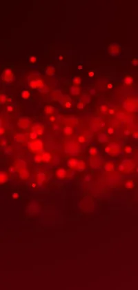 Get a striking red phone live wallpaper that features numerous small dots, a photorealistic background and iridescent accents