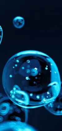 Set your smartphone apart with this mesmerizing live wallpaper featuring floating bubbles