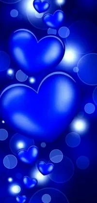 Decorate your phone screen with Blue Hearts Live Wallpaper - a beautifully designed, visually captivating new addition! This romantic wallpaper features several blue hearts artfully arranged and gently floating to create a pleasing and serene effect