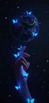 This phone live wallpaper showcases a stunning digital art image of a hand holding a glowing blue globe