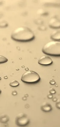 This unique live wallpaper portrays water droplets on a surface in stunning detail and high definition