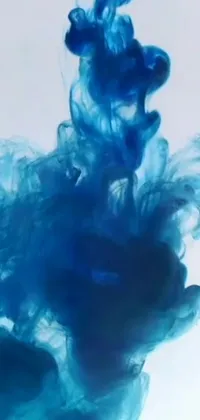 Introducing the latest addition to our phone live wallpaper collection! This captivating video art features a close up of a blue fluid substance in water