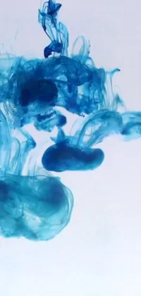 This live phone wallpaper showcases mesmerizing blue substance swirling around in water against a stark white background