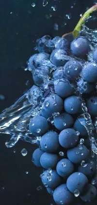 This phone live wallpaper showcases a stunning close-up of grapes immersed in water with mesmerizing metaballs animations adding to its visual appeal