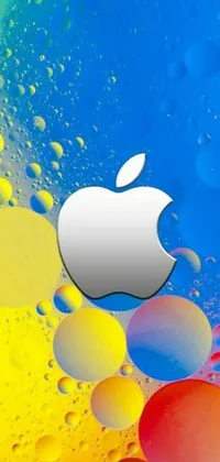 This stunning live wallpaper for your phone features a colorful and eye-catching backdrop with a close up shot of an apple logo