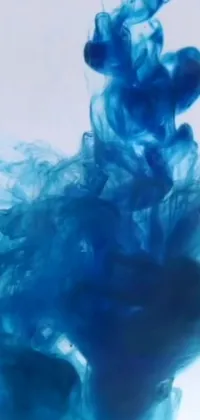 This vivid live wallpaper features a mesmerizing blue liquid swirling in water, with an abstract design created from inkblots and smoke-like colors