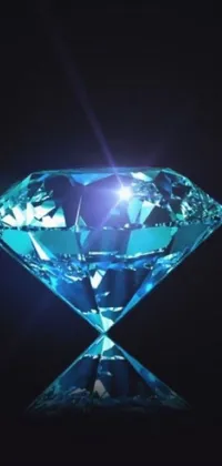 This black background phone live wallpaper features a vibrant blue diamond that gleams in the light
