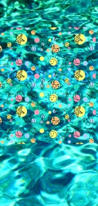This lively phone live wallpaper features a pool of colorful smiley faces surrounded by tropical flora