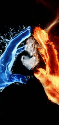 This phone wallpaper showcases a digital rendering of two hands touching each other, emitting orange fire and blue ice