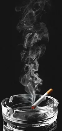 Get this edgy, cool phone live wallpaper featuring a cigarette in an elegant glass ashtray