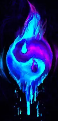 This live wallpaper for your phone features a visually stunning purple and blue yin yang symbol with swirling flames around the edges