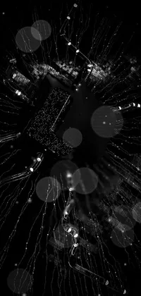 Add a striking touch of elegance to your phone's display with an impressive black and white live wallpaper featuring spectacular fireworks exploding amidst a circuit board-inspired pattern