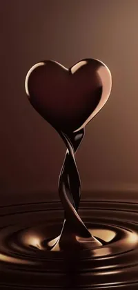 This phone live wallpaper features a beautiful design of a chocolate heart floating in a puddle of water, perfect for your device's home screen