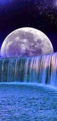 Enjoy a serene and soothing live wallpaper on your phone with this beautiful waterfall and full moon display