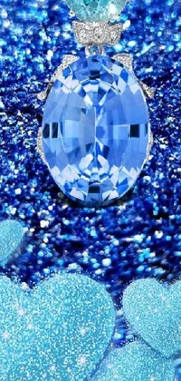 This stunning live wallpaper features a mesmerizing blue diamond set atop a throne of sparkling gemstones, all set against a soothing blue background adorned with hearts