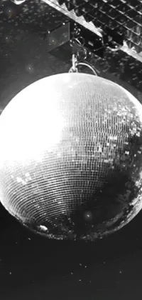 This phone live wallpaper is a stunning black and white photo of a disco ball with a baroque feel