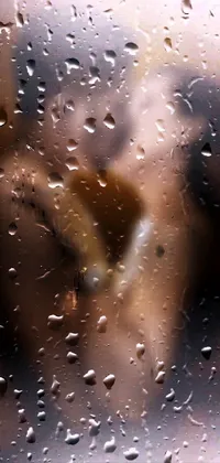 Bring a touch of romance to your phone with this stunning live wallpaper featuring raindrops on a window