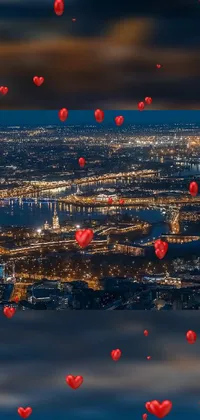 The "Red Hearts Over City" live wallpaper is a charming digital artwork featuring a panoramic view of a city at night