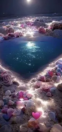 Experience the magic of this heart-shaped water body live wallpaper! Surrounded by rocks, the display includes stunning chalk and fantasy art pieces complemented by the pink moon shining above