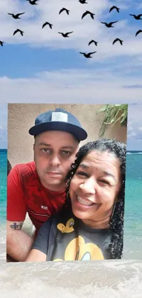 This engaging live wallpaper features a captivating image of a man and a woman standing on a sandy beach in Puerto Rico